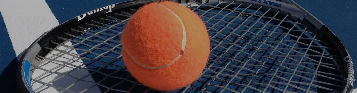 Tennis ball on racquet