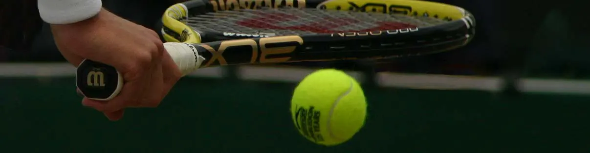 Tennis player preparing to serve